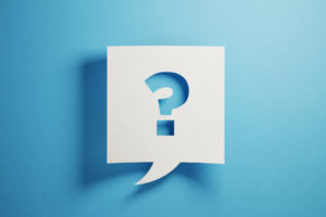 White chat bubble with question mark on blue background